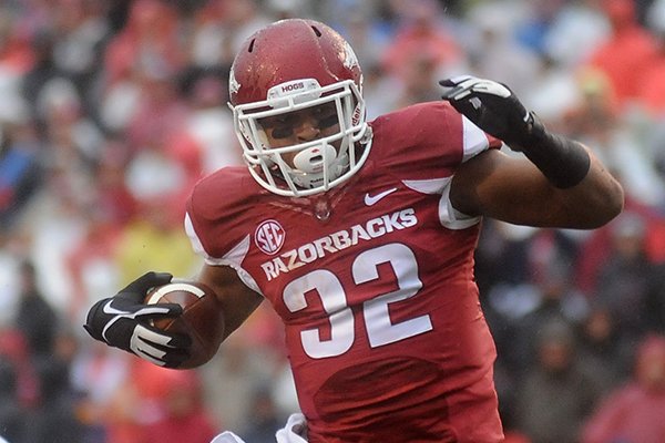 Arkansas running back Jonathan Williams carries the ball during a game against Ole Miss on Saturday, Nov. 22, 2014 at Razorback Stadium in Fayetteville. 