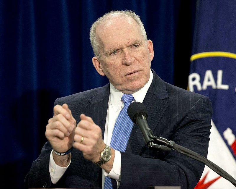 Central Intelligence Director (CIA) Director John Brennan gestures during a news conference at CIA Headquarters in Langley, Va., Thursday, Dec. 11, 2014. Brennan is pushing back hard against the wave of criticism following a Senate Intelligence Committee report detailing harsh interrogation tactics employed by intelligence community people against terrorism war-era detainees. Brennan and several past CIA leaders fear the historical record may define them as torturers instead of patriots. The CIA is now in the uncomfortable position of defending itself publicly, given its basic mission to protect the country secretly. (AP Photo/Pablo Martinez Monsivais)