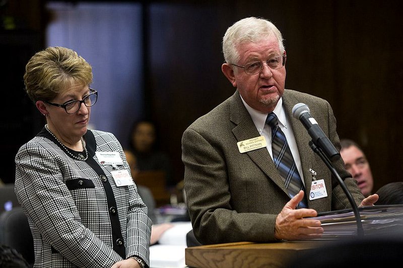 Arkansas Democrat-Gazette/MELISSA SUE GERRITS - 12/11/2014 - Superintendent Bill Pittman, right, Hackett Public School District with Superintendant Teresa Ragsdale of the Hartford Public School District, answers questions by the State School Board members on the topic of annexing Hartford to nearby Hackett Public School during a school board meeting December 11, 2014. The State Board of Education decided to annex the Hartford district that fell under 350 students in two consecutive years to the nearby and only somewhat larger Hackett School District. 
