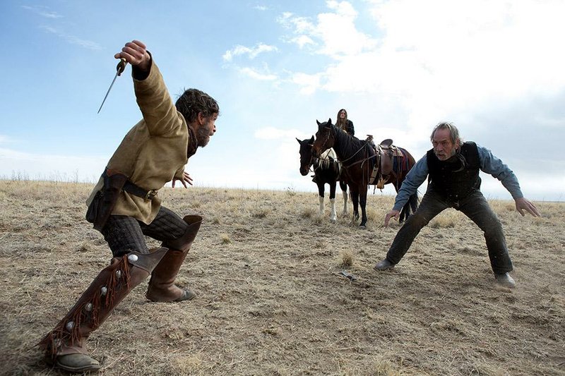 Tim Blake Nelson and Tommy Lee Jones in THE HOMESMAN.