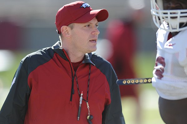 Arkansas defensive coordinator Robb Smith directs his players during practice Thursday, March 20, 2014, at the UA practice field in Fayetteville.