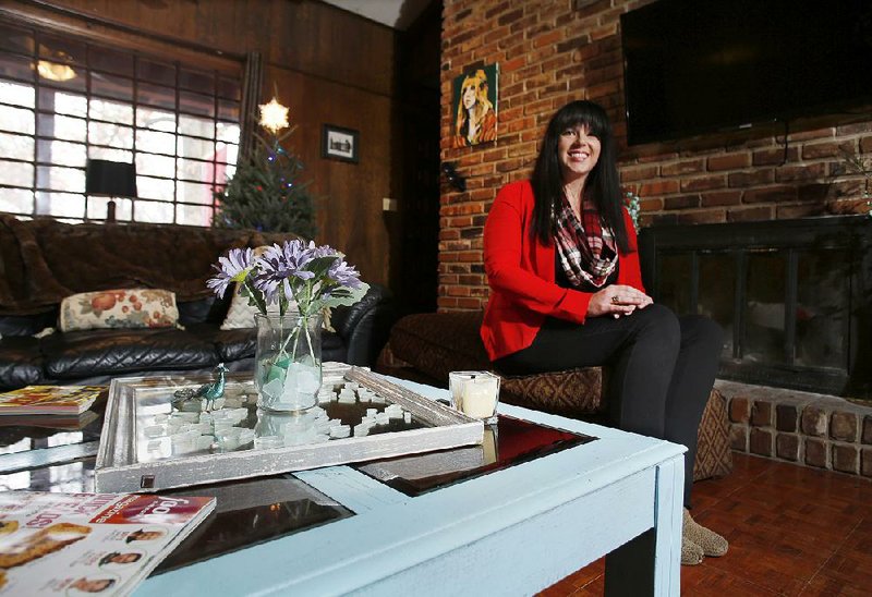 Caroline Reddmann, sits in her favorite personal space Thursday December 4, 2014, the living room of her Fayetteville house.