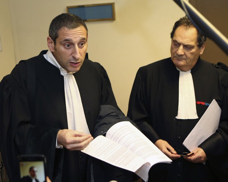 French National Taxi Union lawyers Emmanuel Soussen, left, and Jean Paul Levy, right, address reporters, after a French court ruled over ride-hailing company Uber, at Paris commercial court, Friday Dec. 12, 2014. A French court on Friday ordered Uber to withdraw from its mobile app to French users "all mention suggesting it is legal" for Uber's drivers to act like taxis  that is, driving around and waiting for clients. But the court did not ban the popular ride-hailing service.