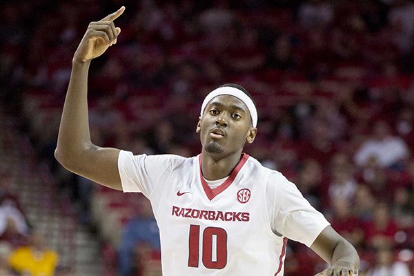Arkansas forward Bobby Portis celebrates after a forced Dayton turnover during the first half of an NCAA college basketball game on Saturday, Dec. 13, 2014, in Fayetteville, Ark. (AP Photo/Gareth Patterson)