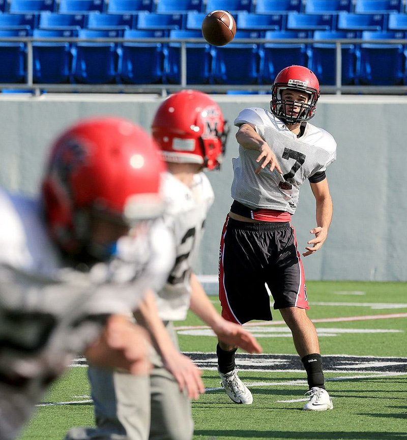 Mena quarterback Sage Kesterson (7) has passed for more than 3,000 yards this season, leading the Bearcats to their first state championship game since 1976.