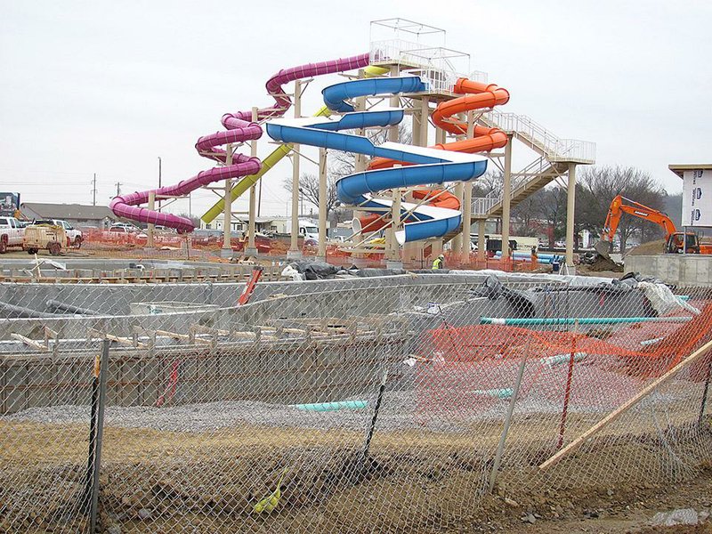 Colorful water slides are the most visible sign of progress at Parrot Island Waterpark at Ben Geren Regional Park in Fort Smith as work on other attractions, including the 500-foot-long lazy river in the foreground, continues.