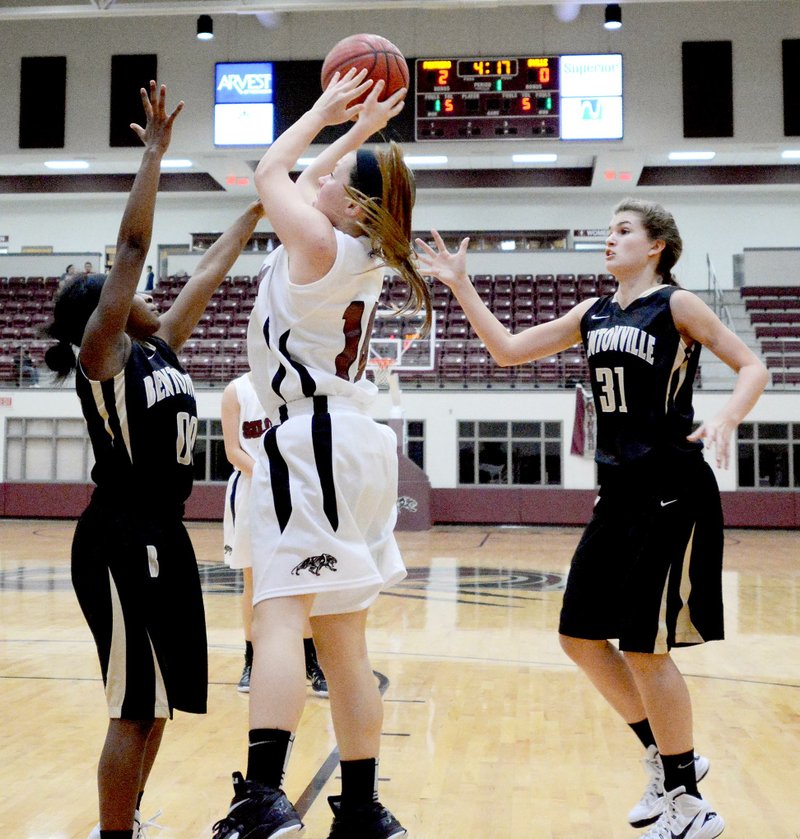 Bud Sullins/Special to Siloam Sunday Siloam Springs ninth-grade guard Morgan Vaughn goes up for a shot Thursday against Bentonville Gold. The Lady Tigers defeated the Lady Panthers 38-29.