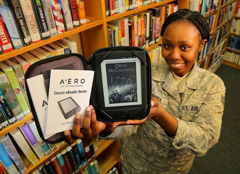 12/10/14
Arkansas Democrat-Gazette/STEPHEN B. THORNTON
Senior Airman Regina Agoha displays a new E-reader made specifically for the Air Force inside the library at the Little Rock Air Force Base in Jacksonville.
