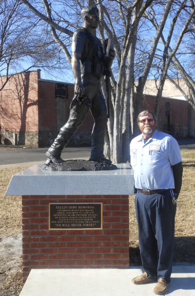 Submitted photo Ronnie Carroll, of City Plumbing, Heating & Electric, stands at the Fallen Hero Memorial, which was the November recipient of City Plumbing&#8217;s Giving Back to the Community program. The statue, part of the Garland County Veterans Memorial near Downtown Historic Farmers Market, is a bronze statue in the likeness of Hot Springs native and Navy Seal Team 6 member Adam Brown, memorializing all those who have given their lives in service to the USA. City Plumbing, Heating & Electric announced this contribution of $1,150 during the Fallen Hero Memorial fundraising event of which Tony Orlando was the honorary chairman. The employees of City Plumbing have voted and given more than $ 71,500 since October 2009.