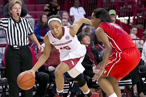 Arkansas guard Kelsey Brooks drives past Rutgers guard Tyler Scaife during a game Sunday, Dec. 7, 2014 at Bud Walton Arena in Fayetteville. 