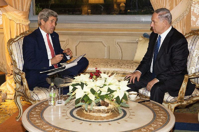 US Secretary of State, John Kerry, left,  meets with Israel Prime Minister Benjamin Netanyahu at Villa Taverna, Rome, on Monday, Dec. 15, 2014. Kerry and Netanyahu met as the U.S. and Israel developed their responses to a draft U.N. resolution that would set a two-year timetable for an Israeli-Palestinian peace accord. (AP Photo/Evan Vucci)