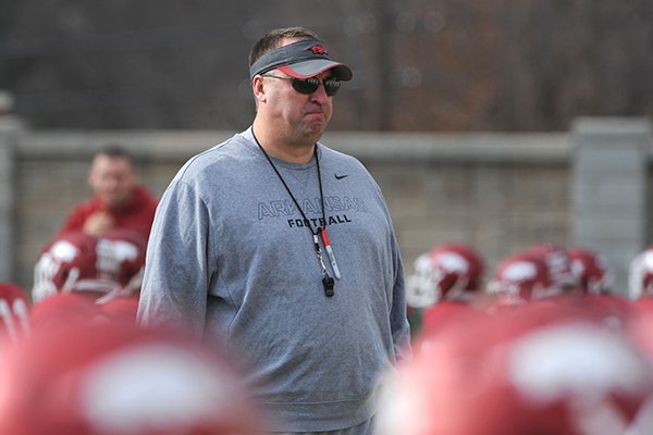 Arkansas coach Bret Bielema watches during practice Saturday, Dec. 13, 2014, at the university's practice facility in Fayetteville.