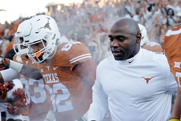 Texas coach Charlie Strong takes the field prior to a game against North Texas on Saturday, Aug. 30, 2014 at Darrell K. Royal - Texas Memorial Stadium in Austin, Texas. (AP Photo/Eric Gay)