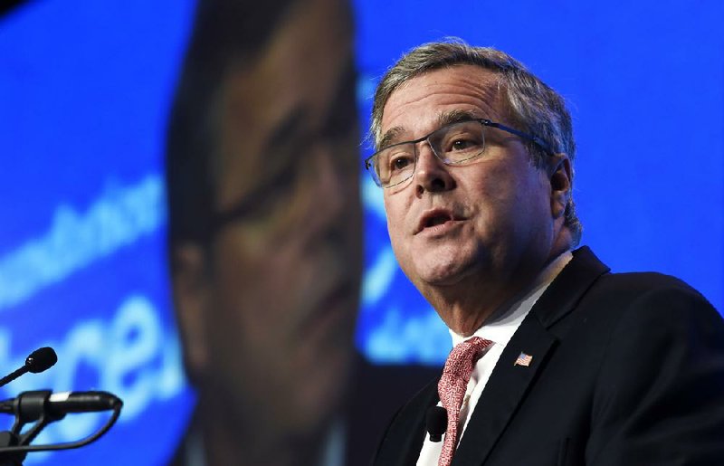 In this Nov. 20, 2014, file photo, former Florida Gov. Jeb Bush gives the keynote address at the National Summit on Education Reform in Washington. On Tuesday, Dec. 16, 2014, Bush took his most definitive step yet toward running for president, announcing plans to "actively explore" a campaign and form a new political operation allowing him to raise money for like-minded Republicans. 