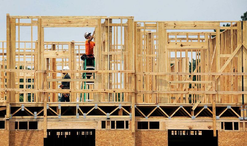 Workers construct a 72-unit apartment complex in New Bern, N.C., in July. Apartment construction rose 6.7 percent in November, the Commerce Department said Tuesday. 