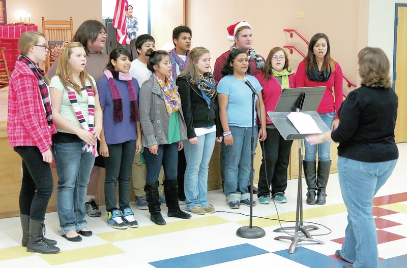 Photo by Mike Eckels The Decatur High School choir started the evening by singing several Christmas songs during the Decatur Christmas Festival Dec. 12 at Northside Elementary.