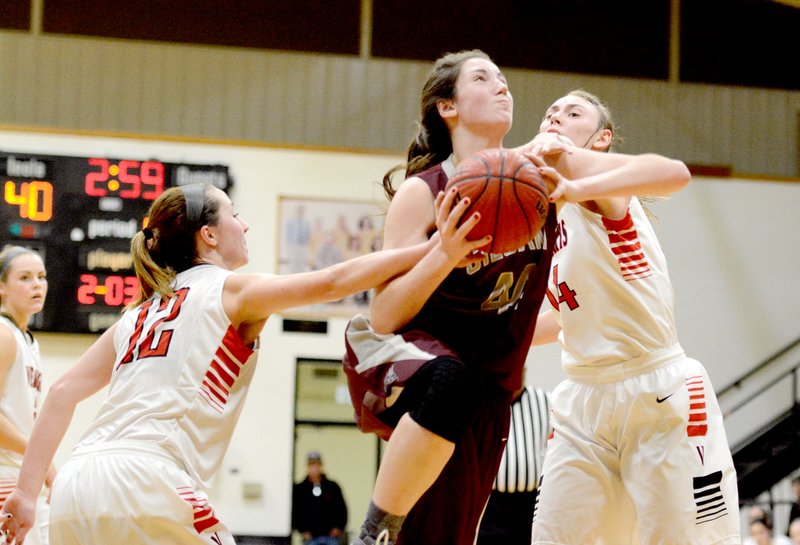 Bud Sullins/Special to the Herald-Leader Siloam Springs senior Baily Cameron powers through the Verdigris defense Saturday during the third place game of the Jerry Oquin Invitational in Inola, Okla. Cameron scored 19 points as the Lady Panthers defeated Verdigris (Okla.) 58-55.