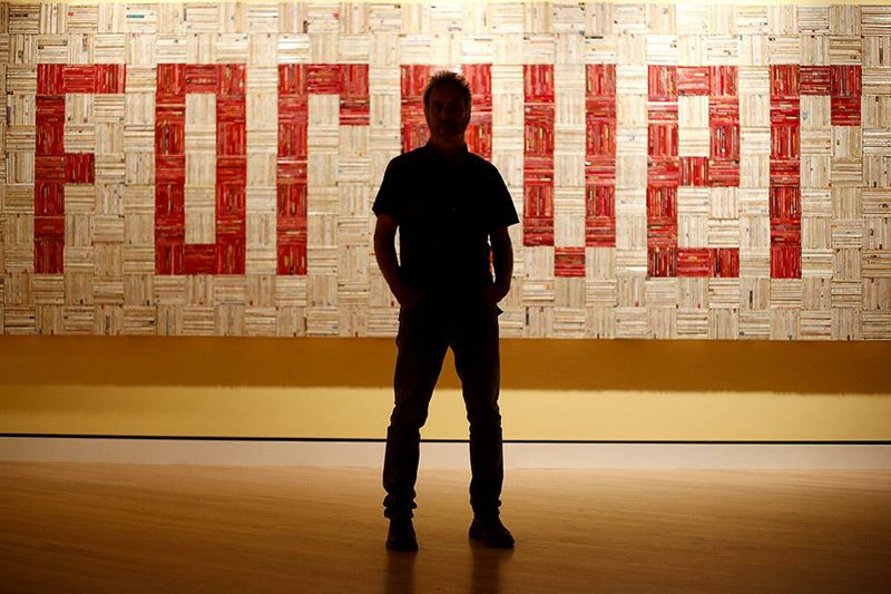 Artist John Salvest stands in front of his work Forever at Crystal Bridges Museum of American Art in Bentonville in this Arkansas Democrat-Gazette file photo from Aug. 8. The piece is one of 227 in the “State of the Art: Discovering American Art Now” show, scheduled to run through Jan. 19 at the museum. 
