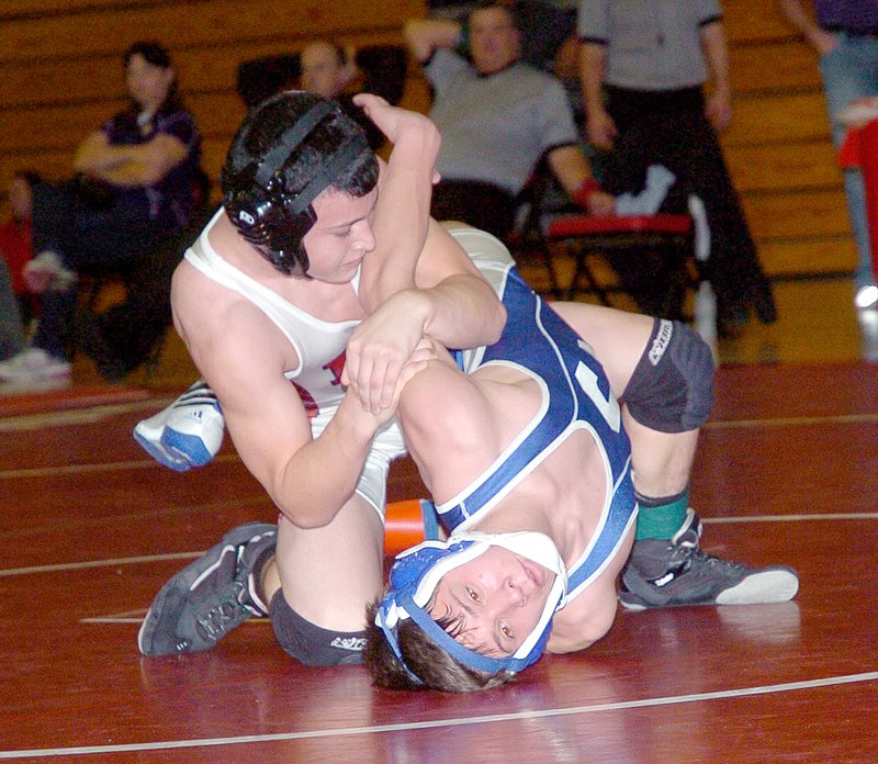 RICK PECK MCDONALD COUNTY PRESS McDonald County&#8217;s Jakob Gerow turns Carthage&#8217;s Nick Norbury to his back on the way to winning a 9-0 decision for the 106 ound championship in the C.J. Classic held Saturday at Carl Junction High School.