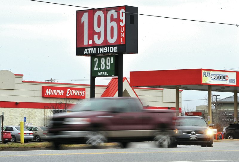 Staff Photo Michael Woods &#8226; @NWAMICHAELW Traffic passes Wednesday by the Murphy Express station on Sunset Avenue in Springdale. Gasoline prices have dropped to $1.96 a gallon, the lowest they have been in several years in Northwest Arkansas.