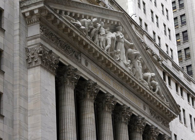 The facade of the New York Stock Exchange, Thursday, Oct. 2, 2014. Global stocks were mostly lower Wednesday Dec. 17, 2014 as oil prices tumbled again while investors waited for a U.S. Federal Reserve statement on monetary policy. 