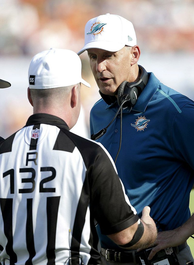 NFL Coaches, like Miami’s Joe Philbin, haven’t seen eye to eye with officials as penalties have increased by more than two per game this season.