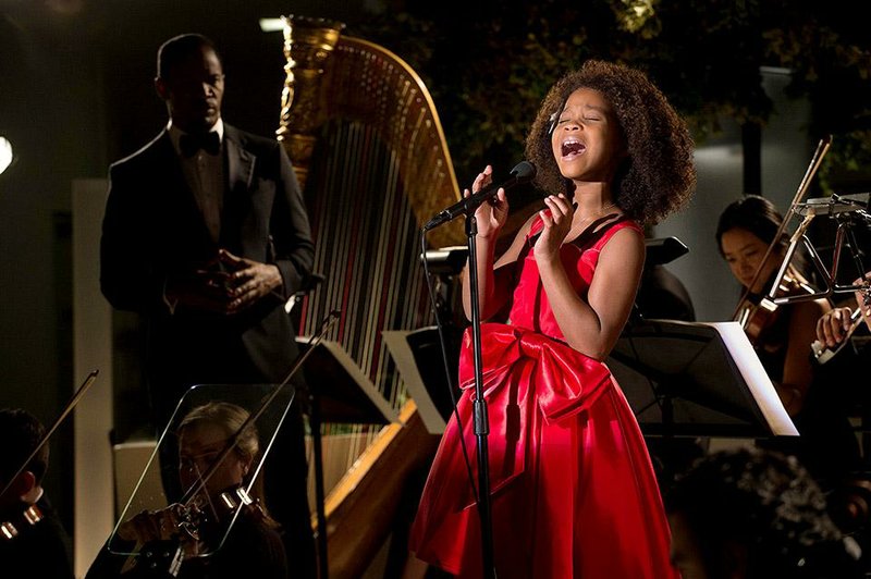 The famous orphan of the title (Quvenzhane Wallis) belts out a tune in Will Gluck’s updated version of the musical based on the Harold Gray comic strip, Annie.