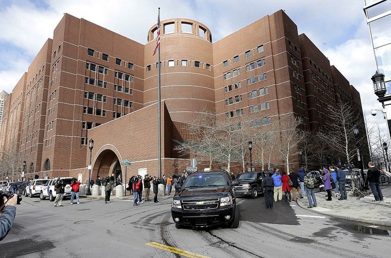 A motorcade carrying Boston Marathon bombing suspect Dzhokhar Tsarnaev leaves federal court in Boston on Thursday, after a final hearing before his trial in January. 