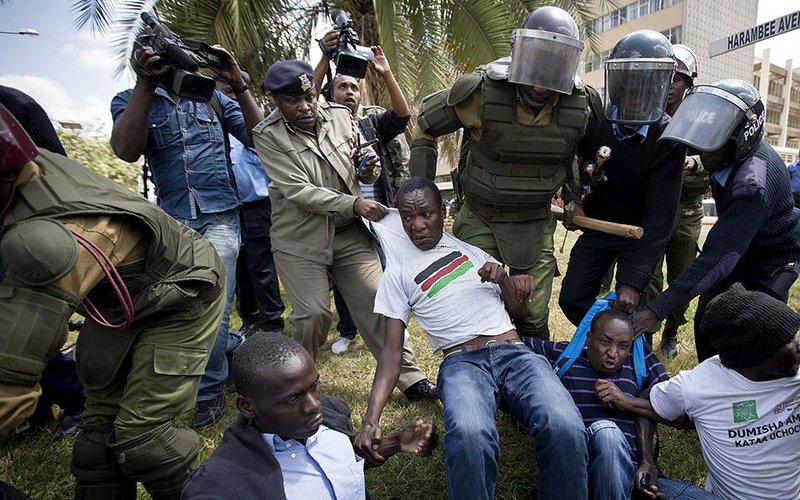 Club-wielding police officers scuffle with protesters Thursday outside Kenya’s parliament building in Nairobi during a demonstration against a contentious security measure that officials say will help fight terrorism but critics say is intended to silence dissent. Fistfights broke out in a chaotic parliament session as legislators argued over the bill.