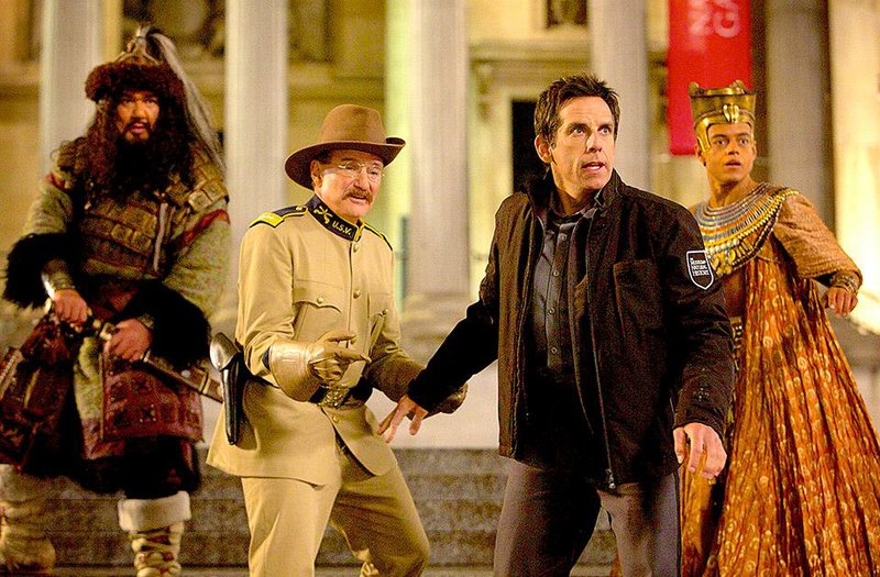 Attila the Hun (Patrick Gallagher), Teddy Roosevelt (Robin Williams), Larry Daley (Ben Stiller) and Ahkmenrah (Rami Malek) react to an unexpected turn of events in Night at the Museum: Secret of the Tomb.