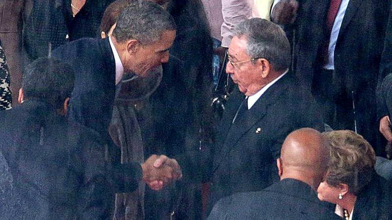 President Barack Obama and Raul Castro in Johannesburg, South Africa, 2013.
