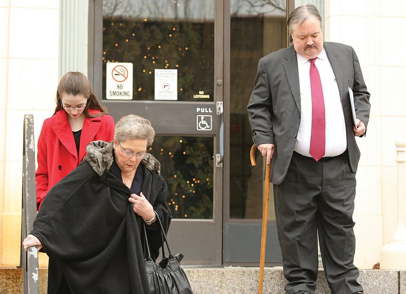 The El Dorado News-Times/Michael Orrell SENTENCING: Former Ouachita County Judge Mike Hesterly leaves the Federal Courthouse with family members on Thursday after being sentenced to 33 months in federal prison on bribery charges in El Dorado.