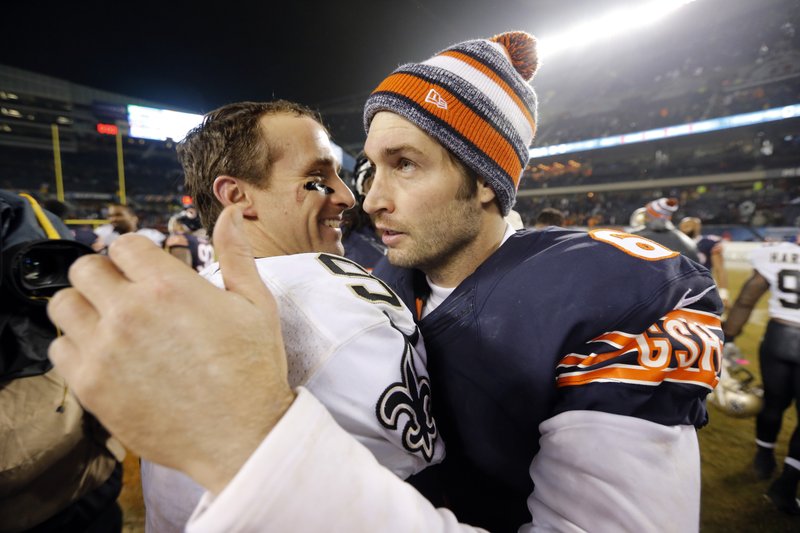 The Associated Press GRIN AND BEAR IT: Bears quarterback Jay Cutler, right, chatting with New Orleans counterpart Drew Brees after Chicago's 31-15 home loss Monday night, is benched in favor of Jimmy Clausen for Sunday's game against the Detroit Lions. Monday's loss dropped the Bears' record to 5-9.