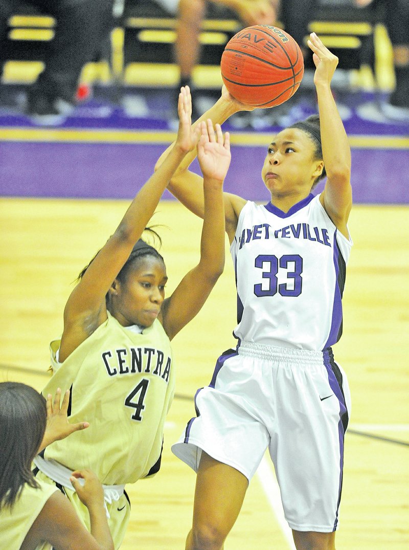 File Photo Michael Woods Lauren Holmes of Fayetteville tries to drive past a Little Rock Central defender during the championship game of the Fayetteville Bulldog Classic tournament at Fayetteville.