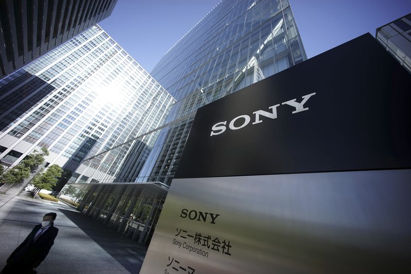 A man walks out from the headquarters of Sony Corp. in Tokyo Thursday, Dec. 18, 2014. Sonys miseries with its television and smartphone businesses were bad enough. Now its American movie division, a trophy asset, is facing tens of millions of dollars in losses from leaks by hackers that attacked the company over a movie that spoofs an assassination of North Korean leader Kim Jong Un. Sony Pictures canceled all release plans for the film at the heart of the hack, "The Interview." 