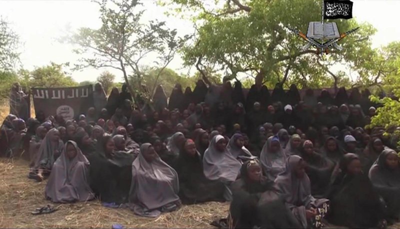 This Monday May 12, 2014 file image taken from video by Nigeria's Boko Haram terrorist network, shows the alleged missing girls abducted from the northeastern town of Chibok. Islamic extremists killed 35 people and kidnapped at least 185, fleeing residents said Thursday of an attack near the town where nearly 300 schoolgirls were taken hostage in April. Teenager Aji Ibrahim said he was lucky to escape into the bushes. "No doubt they were Boko Haram members because they were chanting "Allahu akbar" (God is Great) while shooting at people and torching houses," he told The Associated Press. 