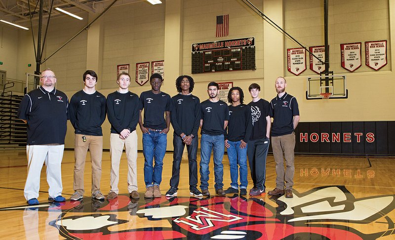 The Maumelle Hornets cross-country team won its second consecutive state title in only its second year of competition. Coaches and team members are, from left, assistant coach Eric Henry, Jackson Fry, Darrius Thomas, Zach Williams, Justin Hines, Jordan Anderson, Hayden Anderson, Sean Adams and head coach Nick Taylor.