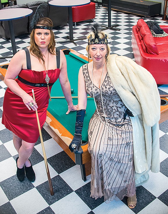 Brooke Andrews, left, and Debbie Broadway strike a pose at a pool table while dressed in their flapper-girl outfits. Such attire will be commonplace for the Starlight Gala set for Dec. 31 at the Benton Event Center. The event carries a theme of “A Gatsby Affair” and benefits the Boys and Girls Club of Bryant.