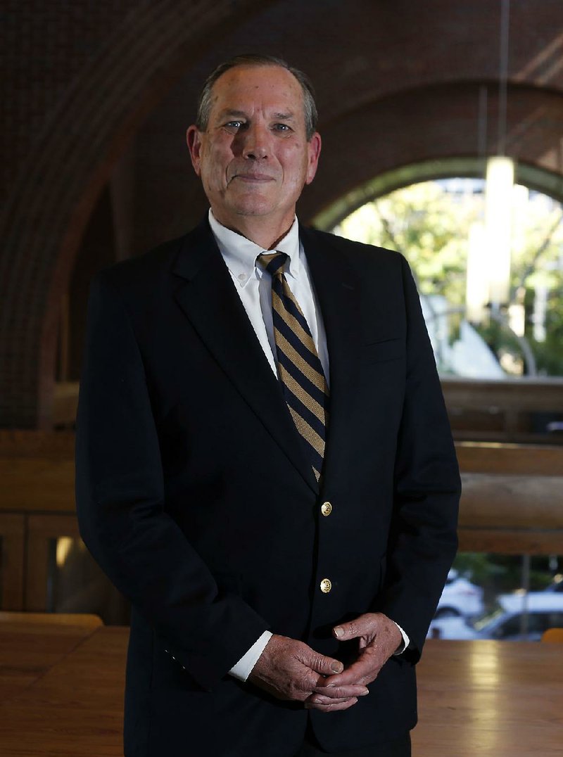  Larry Manry, the Northwest Arkansas regional president of Bank of America, in the lobby of his office on the square in Fayetteville Tuesday October 14, 2014.