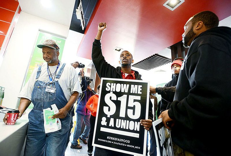 Protesters demonstrate inside a McDonald’s restaurant in Jackson, Miss., earlier this month. The National Labor Relations Board filed complaints Friday against the fast-food giant. 