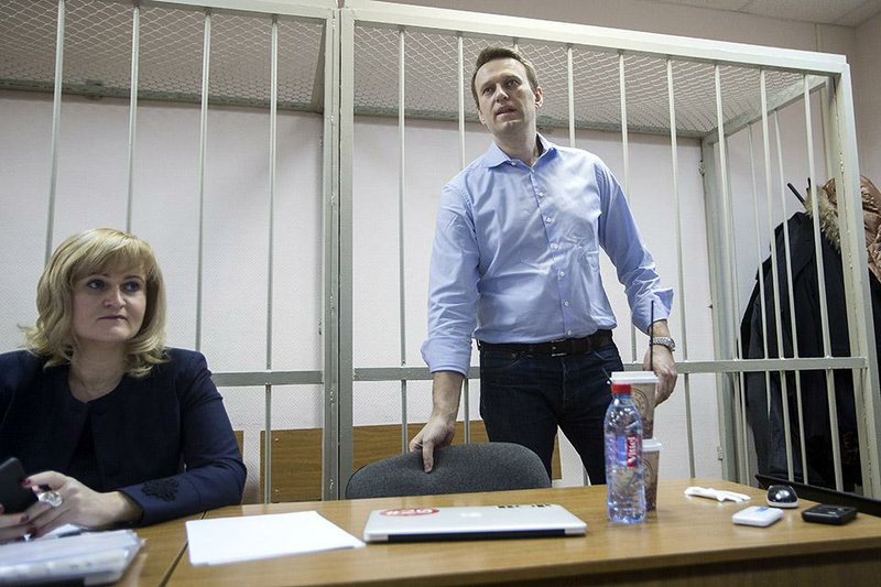 Russian opposition activist Alexei Navalny waits for the start of his trial Friday in Moscow, where he denounced his fraud charges as “nonsense from the first to the last word.” 