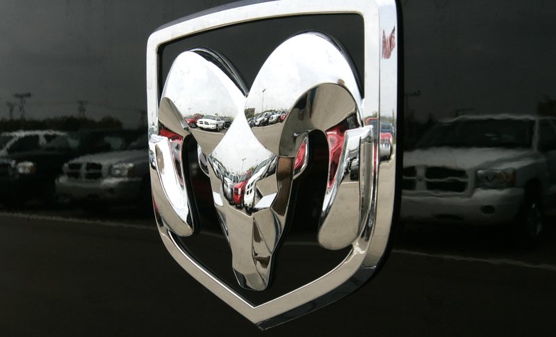 This Thursday, July 27, 2006, file photo, shows the Dodge logo on a Ram pickup truck at a dealership in Bloomfield Hills, Mich. Chrysler is recalling nearly 257,000 older Ram 1500 pickup trucks from the 2005 model year because the rear axle can seize or the drive shaft can fall off. 