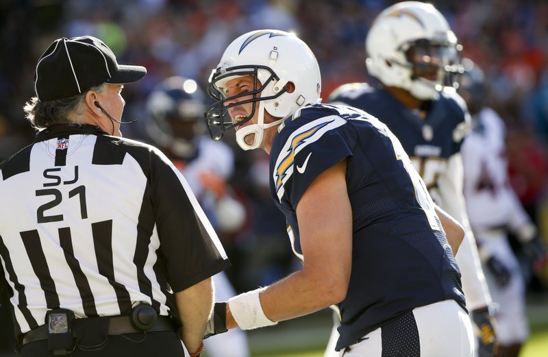 San Diego Chargers quarterback Philip Rivers complains to side judge Jeff Lamberth during the first half of an NFL football game against the Denver Broncos, Sunday, Dec. 14, 2014, in San Diego. 