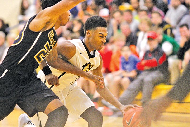  Special To NWA Media Kelli Krebs Jordan Hemphill of Bentonville tries to dribble past a Wheeler guard during Friday&#8217;s game.