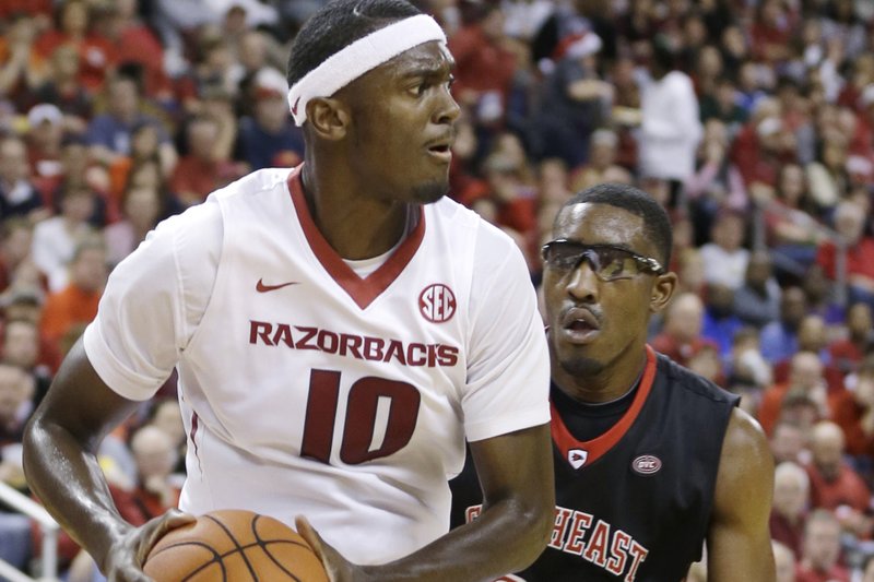 Arkansas's Bobby Portis (10) tries to get around Southeast Missouri State's Aaron Adeoye (24) in the second half of an NCAA college basketball game in North Little Rock, Ark., Saturday, Dec. 20, 2014. Arkansas defeated Southeast Missouri State 84-67. (AP Photo/Danny Johnston)