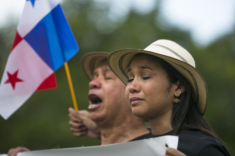 A woman cries during a ceremony in tribute to the victims of the U.S. invasion at a cemetery in Panama City, Saturday, Dec. 20, 2014. The U.S. intervention known as Just Cause began 25 years ago on Saturday, on Dec. 20, 1989, and ended with Noriegas surrender to American drug agents on Jan. 3. The invasion killed 314 Panamanian soldiers and 200 civilians, the government says, while the U.S. military reported losing 23 American soldiers. Local human rights organizations estimated that more than 1,000 Panamanians died. 
