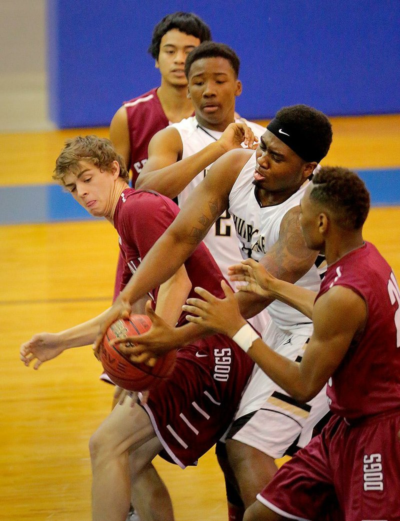 Springdale’s Tyler Tutt (left) and Jonesboro’s Aaron Washington (right) battle for a loose ball during Saturday’s game. 