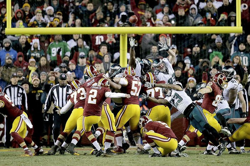 Washington kicker Kai Forbath (center) kicks a 26-yard field goal with five seconds remaining to give the Redskins a 27-24 victory over the Philadelphia Eagles on Saturday.