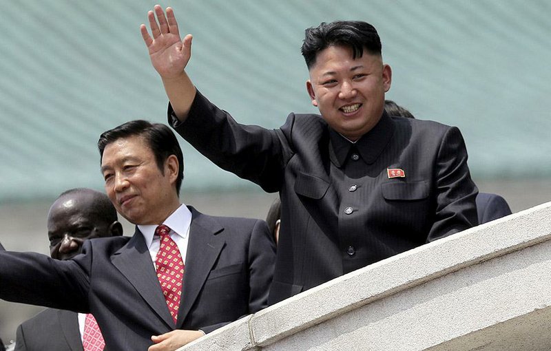 Visiting Chinese Vice President Li Yuanchao (left) and North Korean leader Kim Jong Un attend a military parade in Pyongyang in July 2013. 