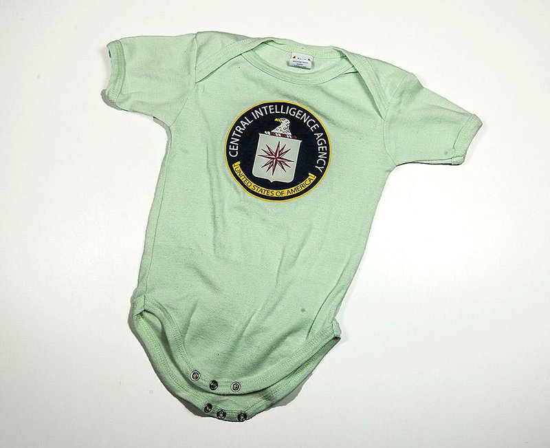 This infant outfit, available at the Central Intelligence Agency gift shop, is among items on some shoppers’ lists this Christmas. 